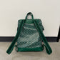 Goyard green Cisalpin backpack back view, padded shoulder straps over signature green Goyardine chevron canvas.