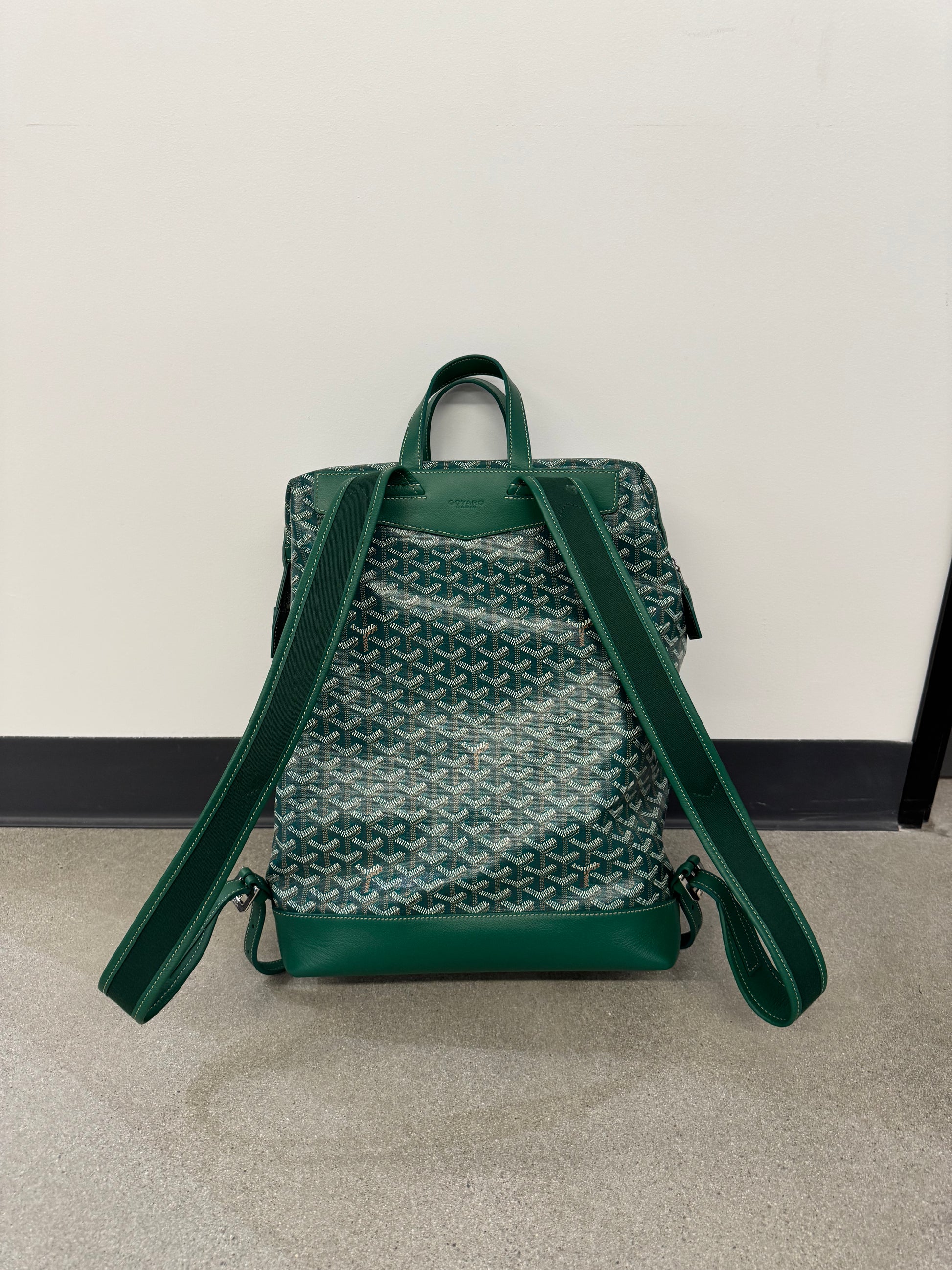 Goyard green Cisalpin backpack back view, padded shoulder straps over signature green Goyardine chevron canvas.
