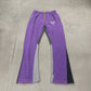 Gallery Dept purple painted flare sweatpants laid flat, showing flared hem and signature paint-splattered finish