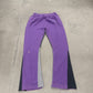 Gallery Dept purple painted flare sweatpants detail view, close-up of violet paint streaks on grey fleece