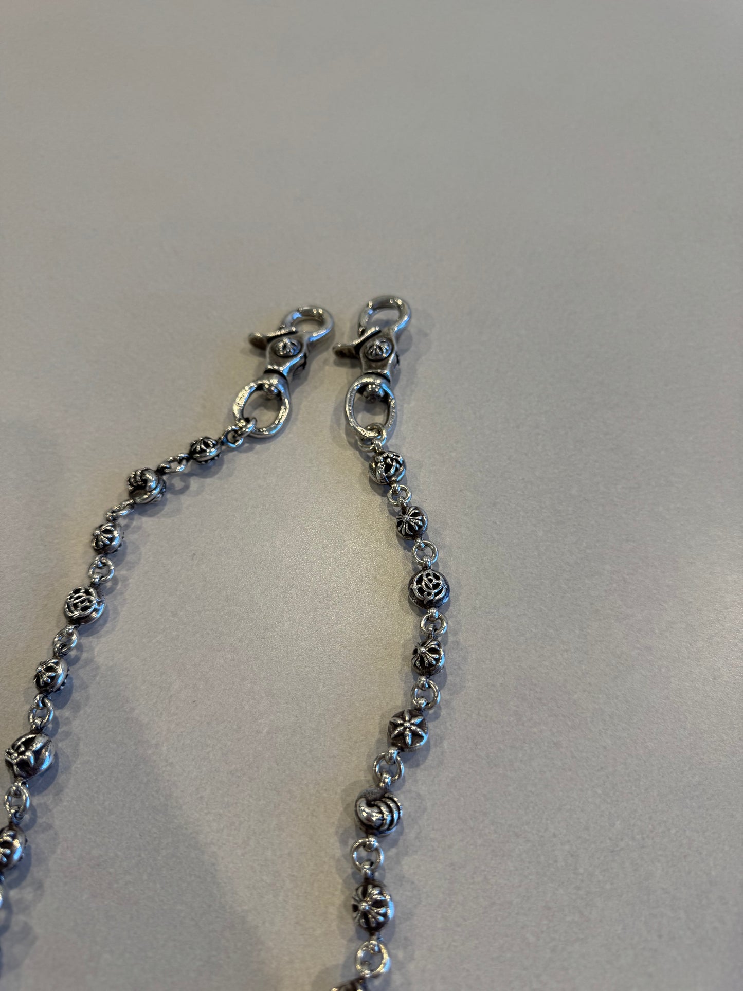 Chrome Hearts sterling silver wallet chain detail showing multi motif cross ball link pattern