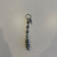 Chrome Hearts Celtic roller ball dagger key ring with silver bead chain, dagger charm and engraved capsule