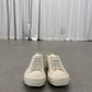 Rick Owens DRKSHDW milk vintage sneakers front view showing tonal lacing and rounded leather toe box