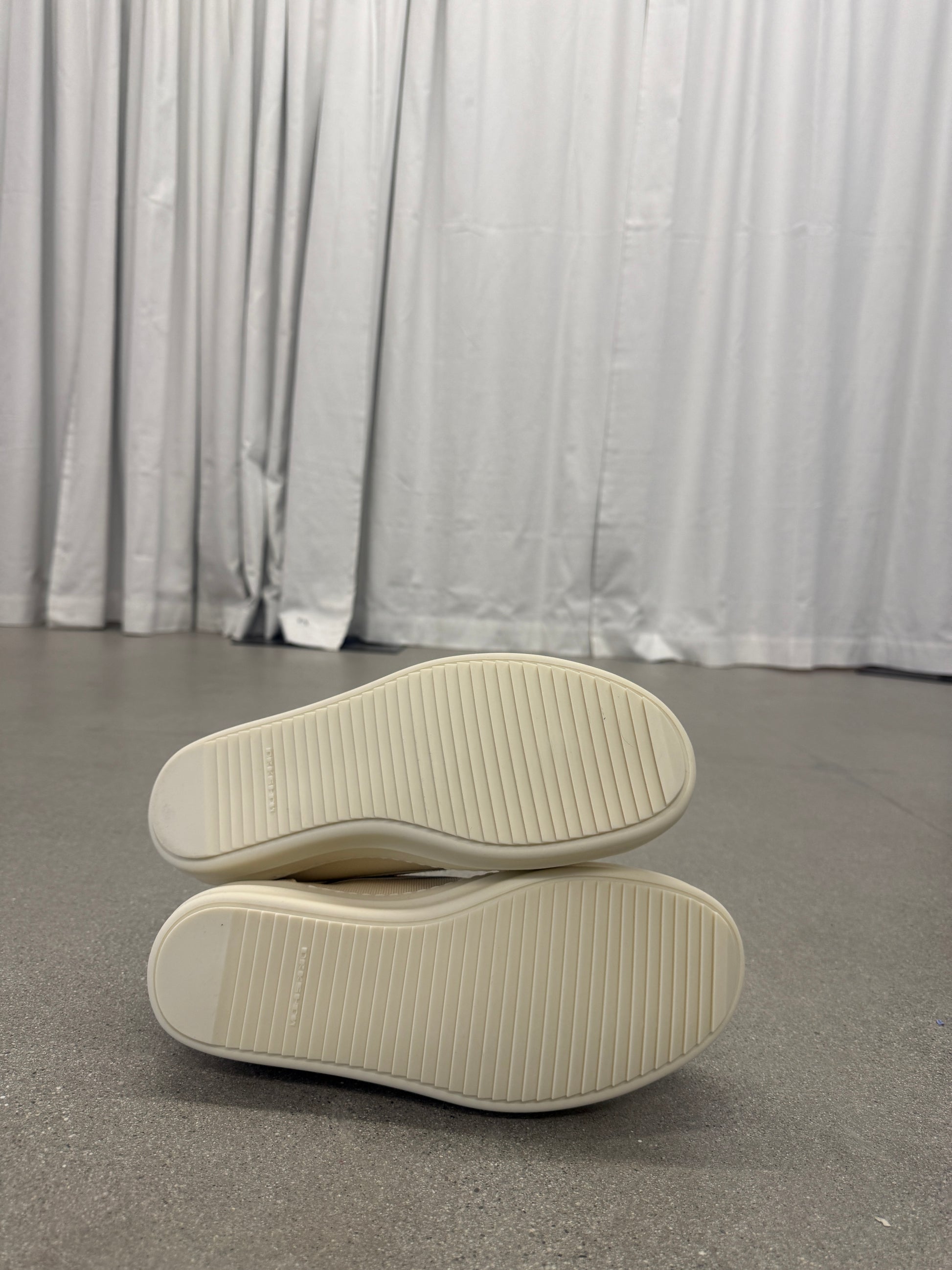 Rick Owens DRKSHDW milk vintage sneakers sole view showing ribbed cream rubber outsoles