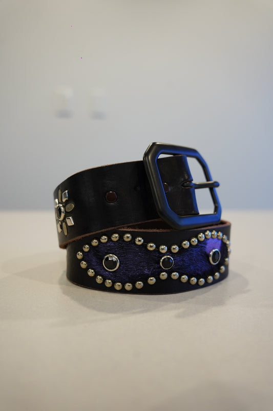 Vintage black leather belt coiled with purple ponyhair studded oval inlay and black square buckle