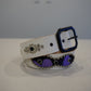 Vintage white leather belt with purple pony hair triple cross panel and silver pyramid stud accents.
