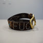 Custom brown cowhide studded belt with brass horseshoe buckle, turquoise stones and FU studded text.
