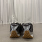 Bottega Veneta Orbit sneakers heel view showing chrome silver counter and stacked gum rubber outsole