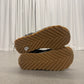 Bottega Veneta Orbit sneakers paired bottom view of woven chevron gum rubber outsole tread pattern