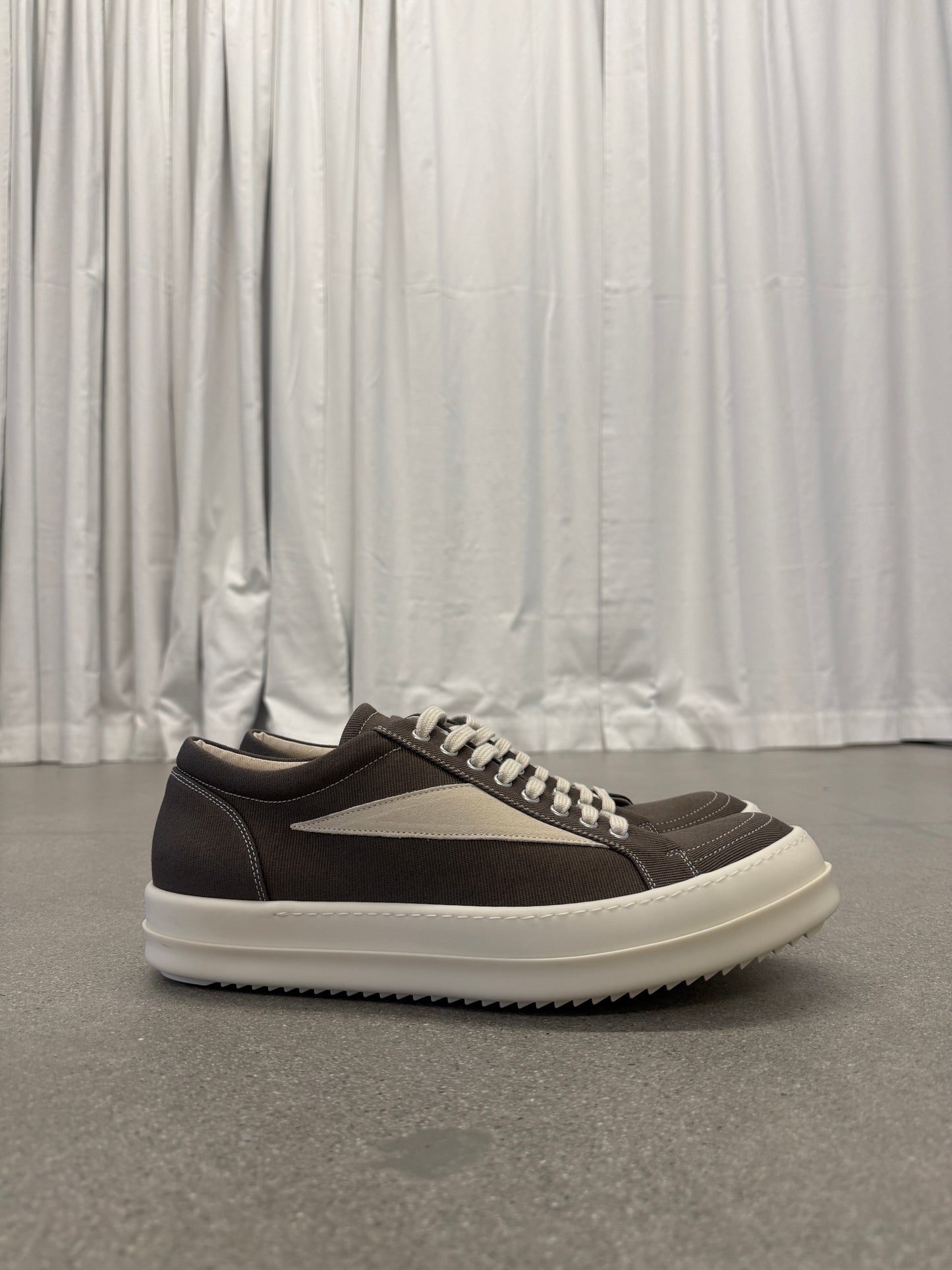 Rick Owens DRKSHDW dust brown low-top sneaker side profile with cream toe cap and chunky white sole