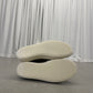Rick Owens DRKSHDW Dust sneakers sole-up view showing cream ribbed rubber outsoles with branding