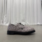 Supreme Dr Martens Postal 4-eye shoe side view in grey python snakeskin with chunky black lugged sole