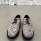 Supreme Dr Martens snakeskin Postal derby front pair view with 4-eye lacing and tan inner tongue tag