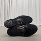Supreme Dr Martens Postal snakeskin shoe outsoles showing black commando lug tread and embossed branding