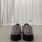 Supreme Dr Martens snakeskin Postal 4-eye shoe back view with python texture heels and black lug platform