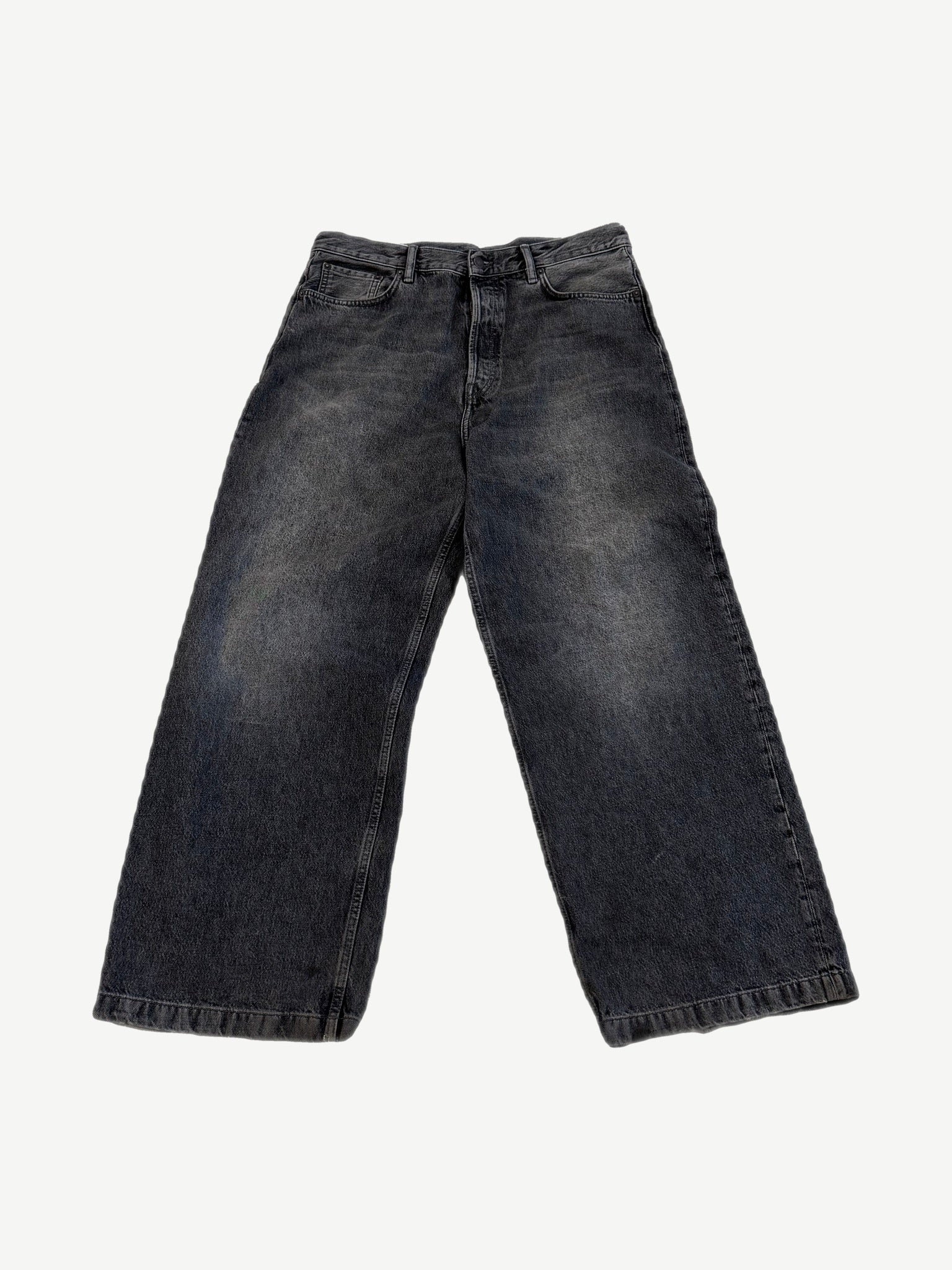Acne Studios 1989 ash black wide-leg jeans front view with faded whiskers and five-pocket styling