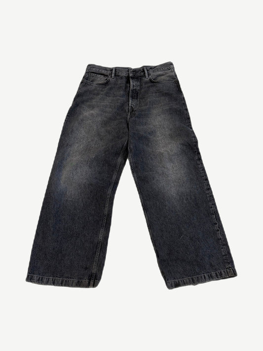 Acne Studios 1989 ash black wide-leg jeans front view with faded whiskers and five-pocket styling