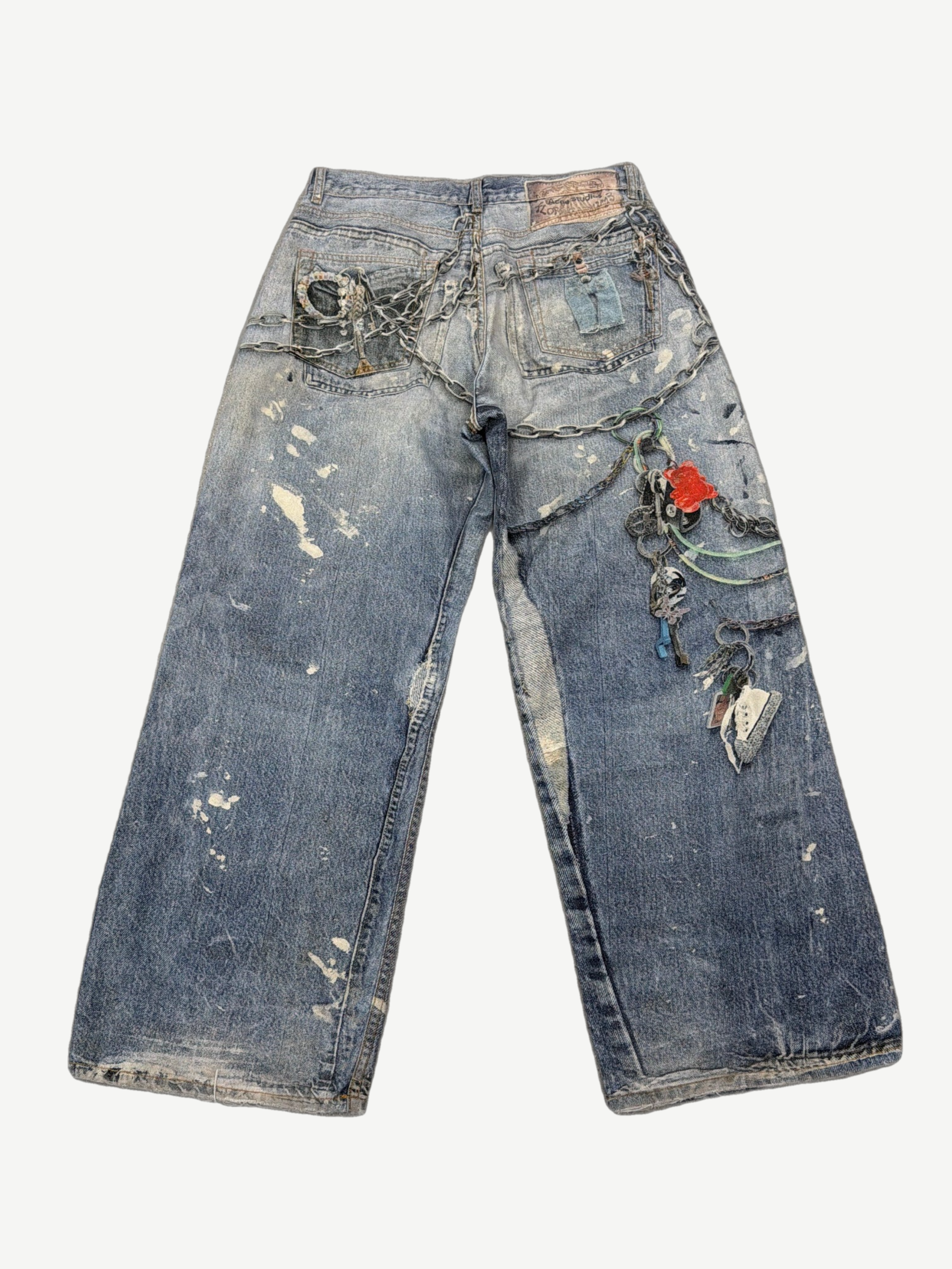Acne Studios trompe l'oeil keychains jeans back view in faded denim with five-pocket construction.