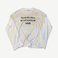 Acne Studios dusty white cotton longsleeve tee with tonal printed logo at chest and relaxed boxy fit.