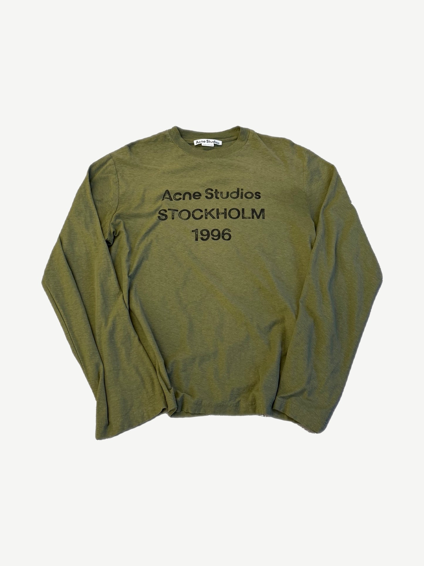 Acne Studios olive green longsleeve tee with black Stockholm 1996 distressed logo print on chest.