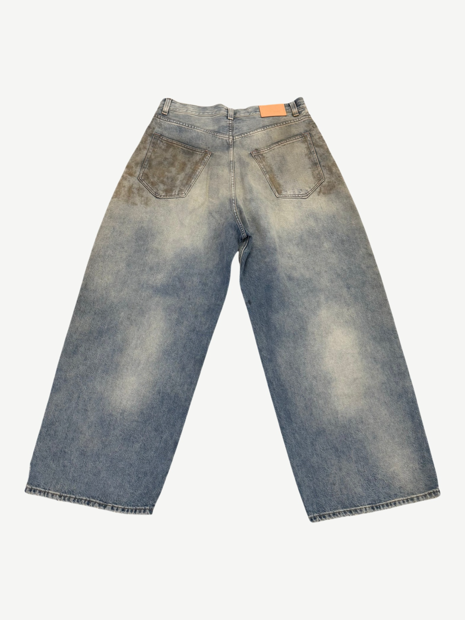 Acne Studios Penicillin mud wash jeans back view in faded blue denim with orange logo patch and patch pockets