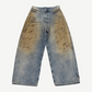 Acne Studios Penicillin baggy jeans front view in light blue denim with brown mud-wash front thigh staining