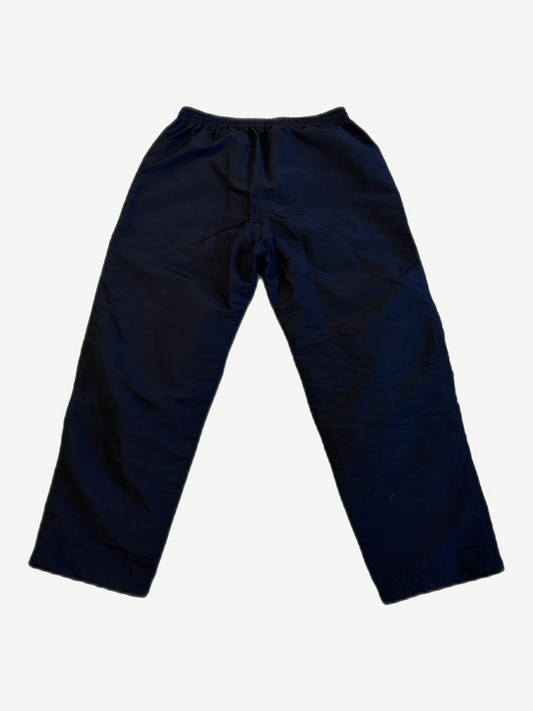 Back of Balenciaga 3B Sports Icon black tracksuit pants showing straight-leg silhouette and elastic waist