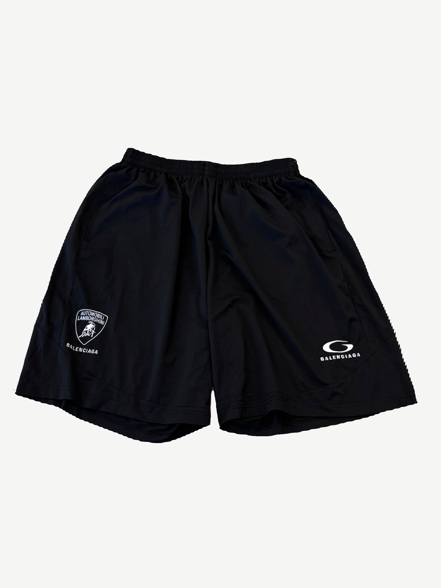 Balenciaga Automobili Lamborghini baggy shorts in black with Lamborghini crest and Balenciaga logo on legs.