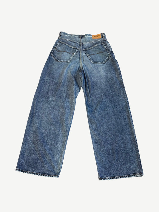 Balenciaga baggy jeans back view with five-pocket construction, leather tab and acid wash finish