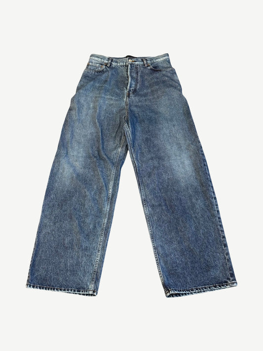 Balenciaga baggy trompe l'oeil jeans front view in mid wash blue denim with wide leg silhouette