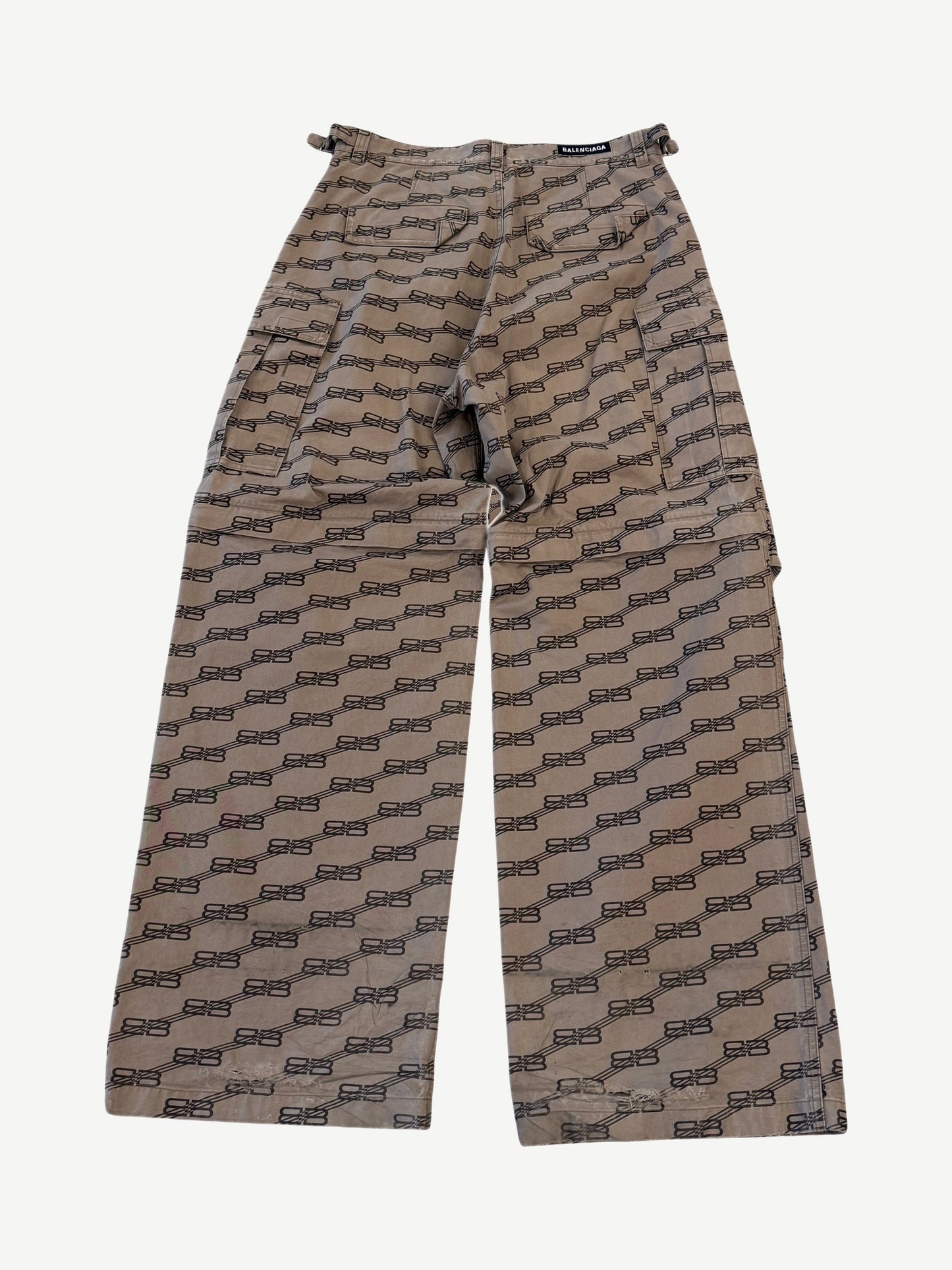 Balenciaga brown cargo pants with allover BB monogram jacquard pattern and side cargo pockets, front view.