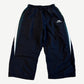 Balenciaga black 3B Sports Icon trackpants front with white wave logo and white curved side stripes on nylon