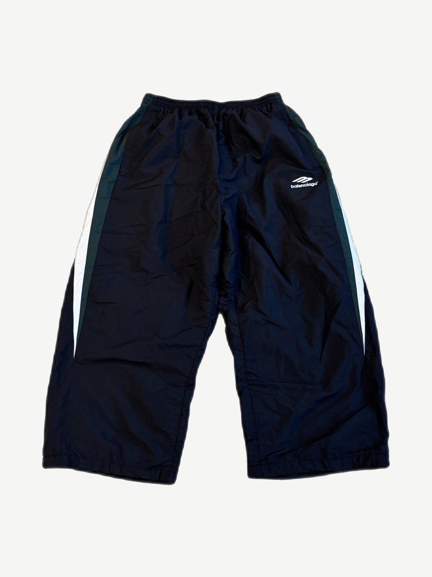 Balenciaga black 3B Sports Icon trackpants front with white wave logo and white curved side stripes on nylon
