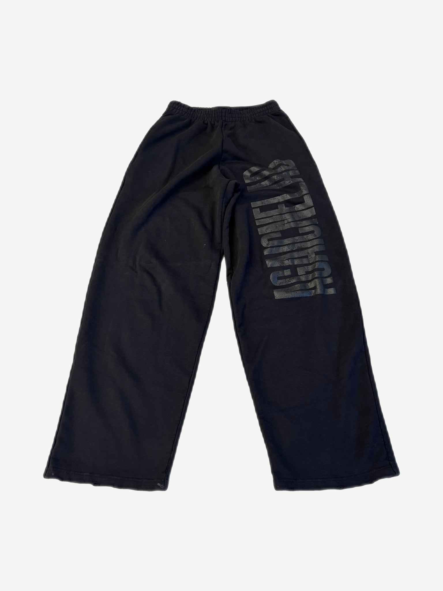 Balenciaga Agaicnelab black baggy sweatpants back view with tonal vertical logo print on leg