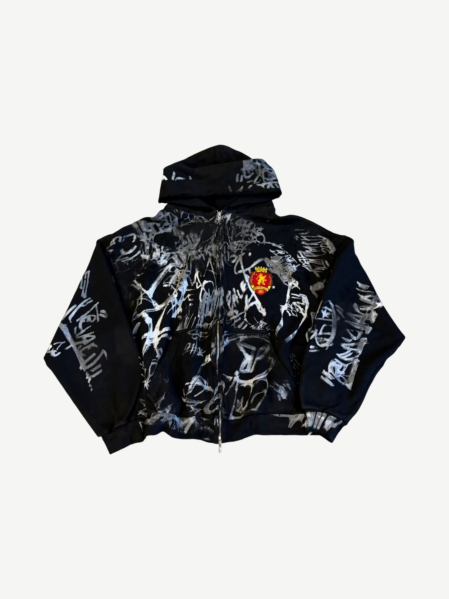 Balenciaga black skater zip up hoodie covered in hand drawn graffiti scribbles with red crest patch.
