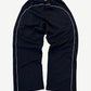 Balenciaga soccer crest sweatpants back view with white side piping running the length of each leg seam.