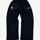 Balenciaga black soccer crest sweatpants with embroidered heraldic lion shield and sportswear wing logo on thighs.
