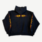 Balenciaga black Unity flame zip hoodie back, orange tribal flame graphic across upper back and sleeves.