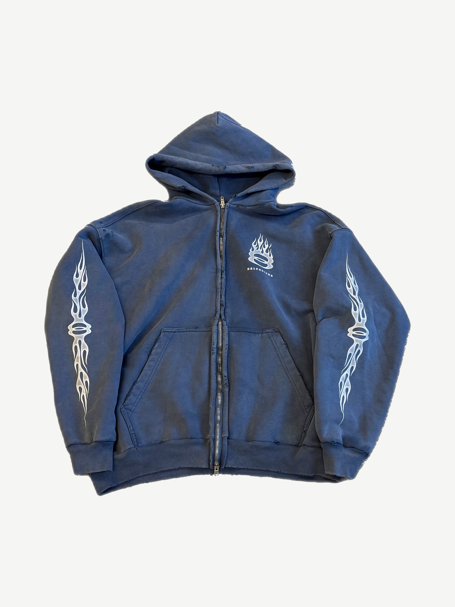 Balenciaga blue distressed zip hoodie with white flame sleeve graphics and small flame chest crest.