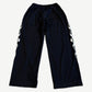 Balenciaga Burning Unity black mesh pants back view with mirrored tribal flame leg graphics