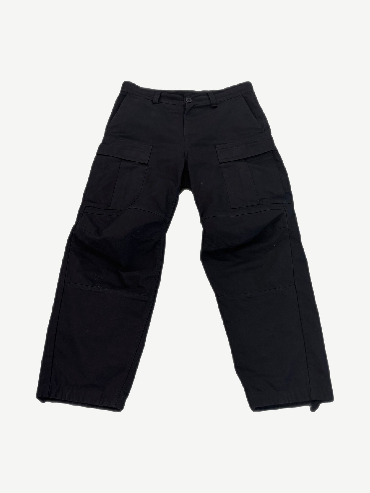 Balenciaga Kick Knee black cargo pants front view with flap thigh pockets and articulated knee paneling