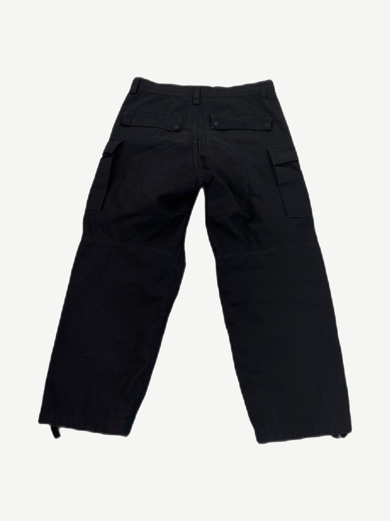 Balenciaga Kick Knee black cargo pants back view with flap rear pockets and seat reinforcement panel
