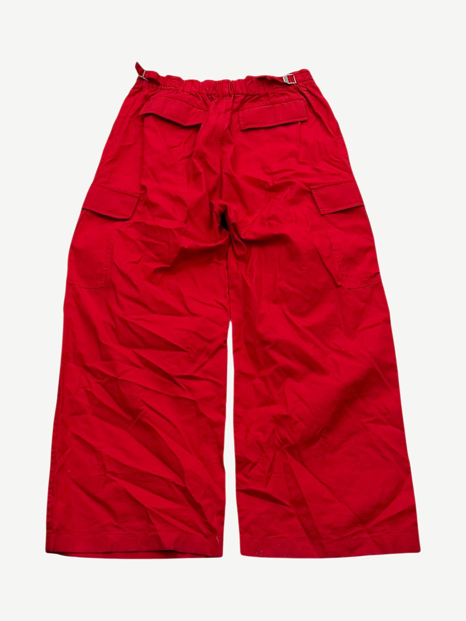 Balenciaga oversized red soft cargo pants back view in bright red with rear flap pockets and wide leg