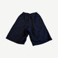 Back of Balenciaga Under Armour navy sweat shorts with elastic drawstring waist and plain knee-length cut.