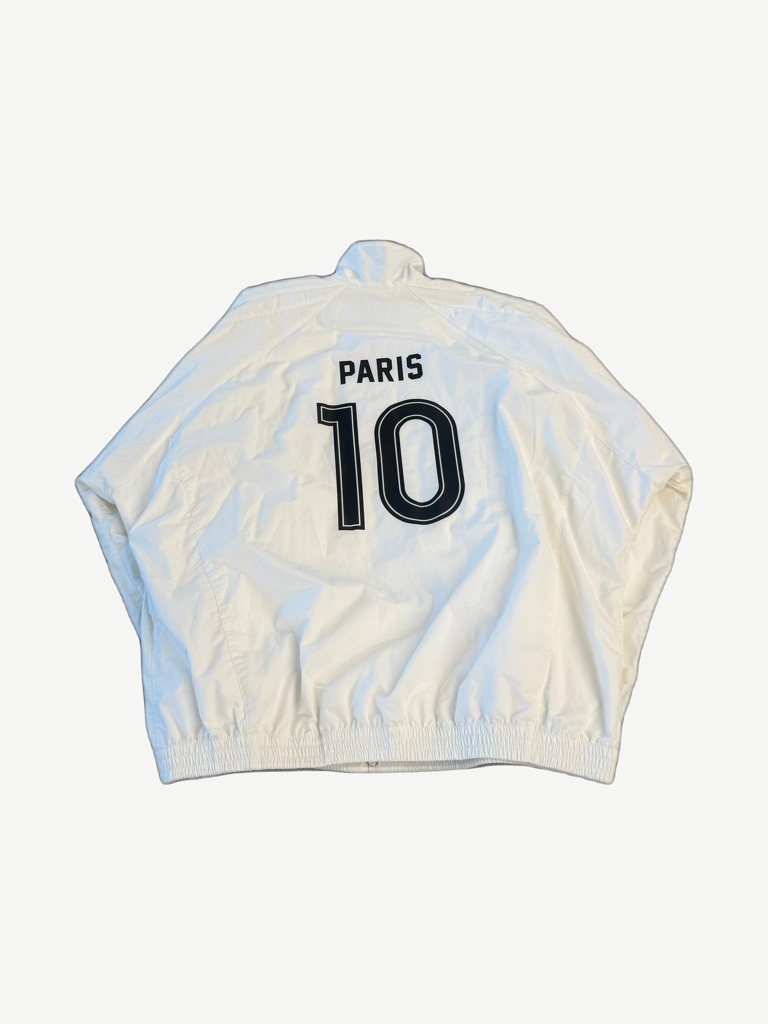 Balenciaga white Paris track jacket back view with jersey-style Paris 10 print on glossy nylon shell