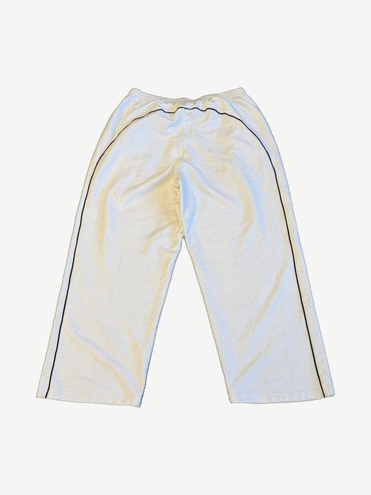 Balenciaga white soccer crest sweatpants back view with elastic waistband and straight leg fleece silhouette