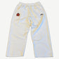 Balenciaga white cotton sweatpants with embroidered red lion soccer crest and Balenciaga wing logo on hip