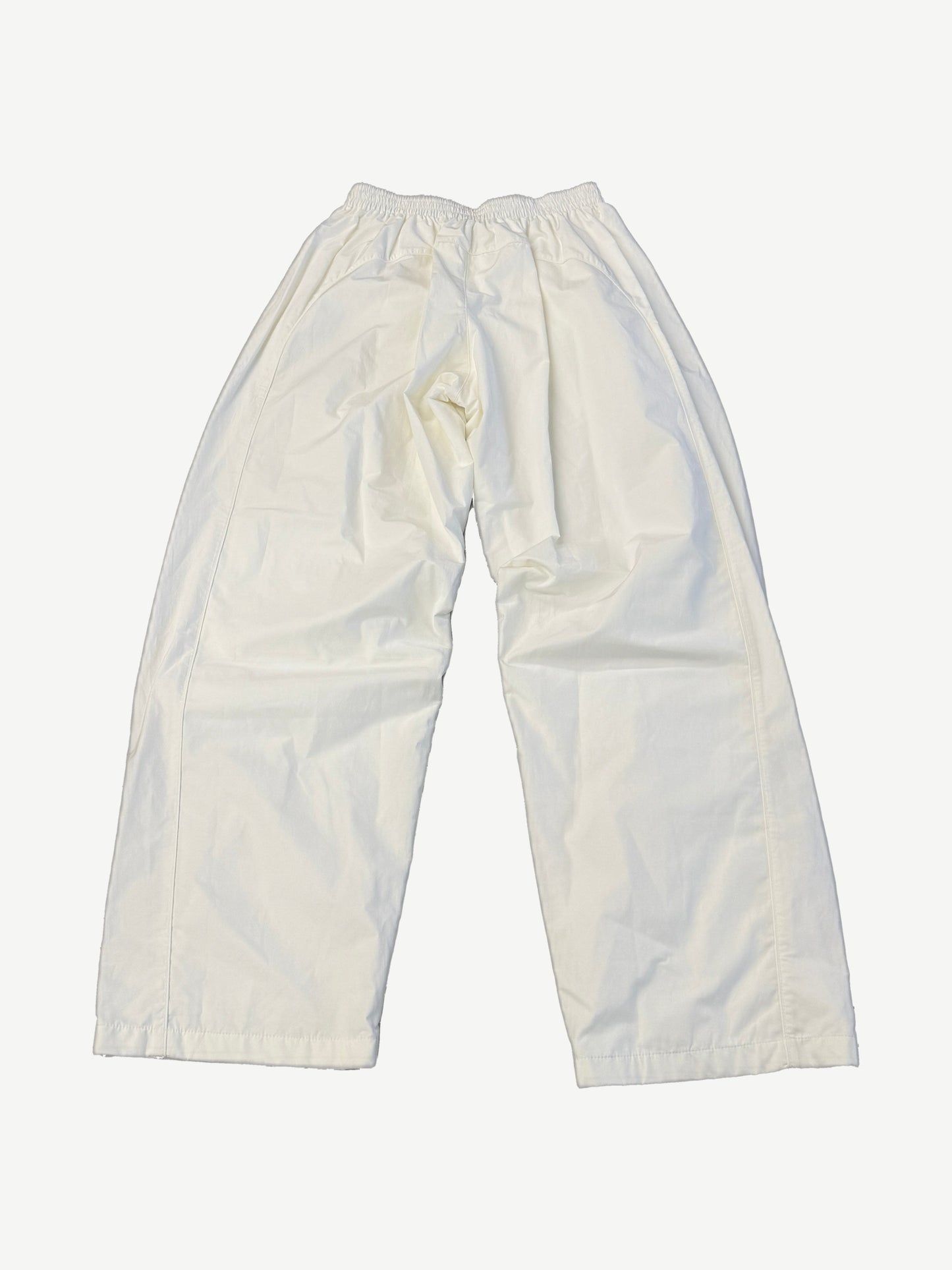 Balenciaga white soccer crest trackpants back view with relaxed wide leg cut and clean tonal stitching.