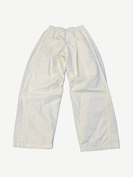 Balenciaga white soccer crest trackpants back view with relaxed wide leg cut and clean tonal stitching.
