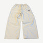 Balenciaga white tracksuit pants in cream nylon with embroidered Balenciaga logo on hip and elastic waist.